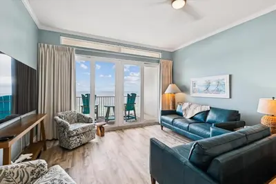 a living room with a couch and a table at Laketown Wharf 2123 condo in Panama City Beach