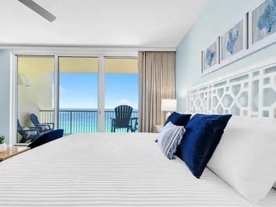 a bedroom with a large bed with a view of the ocean at New BeachFront-Majestic Beach Resort-Starbucks in Panama City Beach