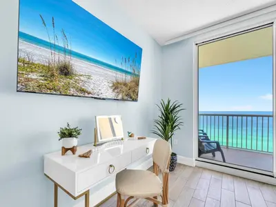 a white desk in a room with a view of the beach at New BeachFront-Majestic Beach Resort-Starbucks in Panama City Beach