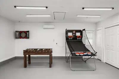 a game room with a table and a game at Salt Water POOL, GAME room, KING BED &PET friendly in Panama City