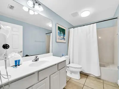 a bathroom with a sink and a toilet and a shower at Sunrise Beach #1707 in Panama City Beach