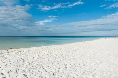 a white sandy beach with the ocean in the background at Celadon 203 in Panama City Beach