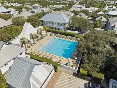 an aerial view of a house with a swimming pool at 90 N Cartagena Carriage House by 30A Escapes in Rosemary Beach