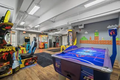 a play room with a pool table and arcade games at Emerald Beach Resort 1734 - Amazing Views, Beachfront, King Bed, 3 Pools, Starbucks in Panama City Beach