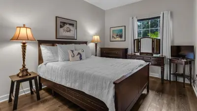 a bedroom with a large bed and a television at Secluded Sanctuary By the Sea in Seacrest