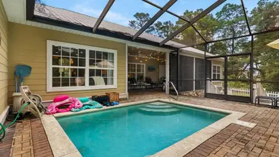 a swimming pool in the backyard of a house at Secluded Sanctuary By the Sea in Seacrest