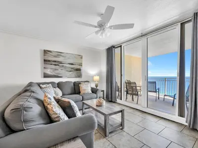 a living room with a couch and a ceiling fan at Emerald Beach 2336 by Emerald Coast Retreats in Panama City Beach