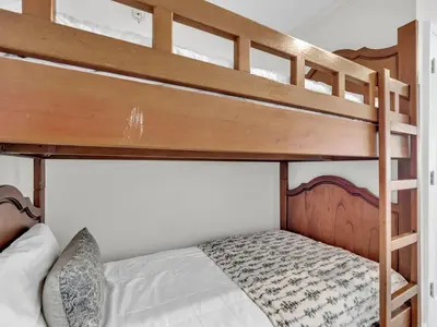 a bedroom with two bunk beds in a room at Emerald Beach 2336 by Emerald Coast Retreats in Panama City Beach