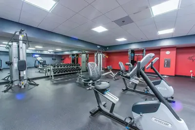 a gym with several cardio machines in a room at Emerald Beach 2336 by Emerald Coast Retreats in Panama City Beach