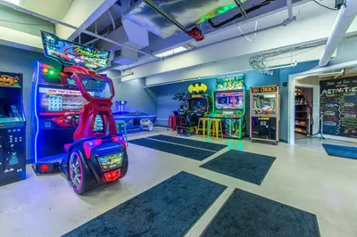 a room with arcade games and a video game console at Emerald Beach 2336 by Emerald Coast Retreats in Panama City Beach