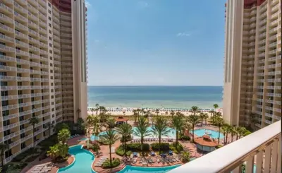 a view of the beach from the balcony of a resort at Shores of Panama 816 by Emerald Coast Retreats in Panama City Beach