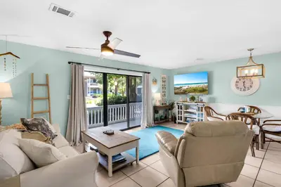 a living room with a couch and chairs and a table at Sunny Daze at Beachwood Villas - Walk to Beach Outdoor Pools & More in Santa Rosa Beach
