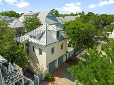 an aerial view of a house with a metal roof at Piccadilly Carriage House in Rosemary Beach
