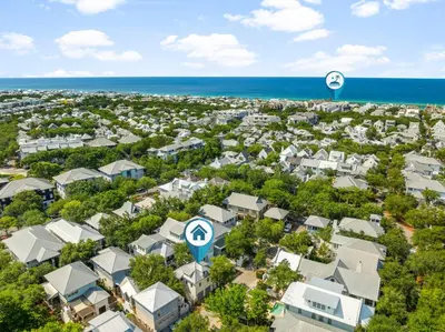 an aerial view of a city with houses and the ocean at Piccadilly Cottage in Rosemary Beach