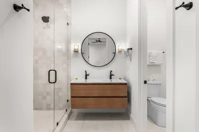 a bathroom with a sink and a mirror at On Deck in Panama City Beach