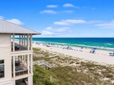 a view of the beach from the balcony of a beach house at On Deck in Panama City Beach
