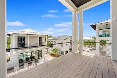 a balcony with a view of a house at On Deck in Panama City Beach