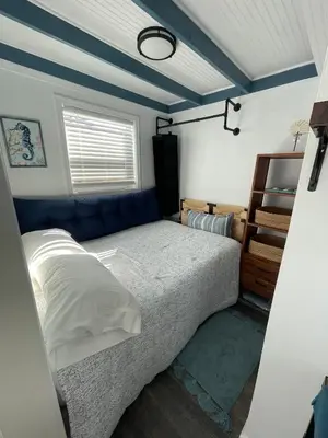 a bedroom with a bed in a room at The Blue Umbrella at the Beach in Panama City Beach