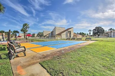 a swimming pool with a bench in a park at Cheerful 1-bedroom townhouse with spacious loft in Panama City Beach