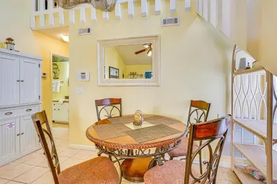 a dining room with a table and chairs at Cheerful 1-bedroom townhouse with spacious loft in Panama City Beach