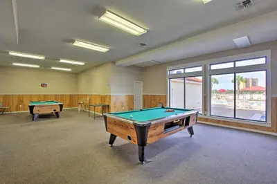 a large room with a pool table in it at Cheerful 1-bedroom townhouse with spacious loft in Panama City Beach
