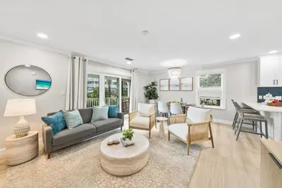 a living room with a couch and a table at Beachside Villas 811 in Watersound Beach