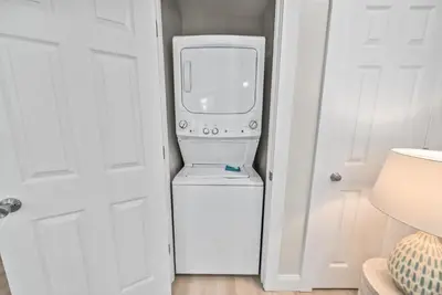 a white washer and dryer in a room at Beachside Villas 811 in Watersound Beach