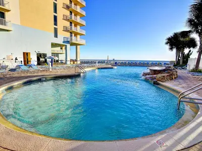 a large swimming pool next to a building at Majestic Beach Towers II #1806 in Panama City Beach
