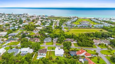 an aerial view of a neighborhood with houses and the ocean at Pet Friendly Beach House - Baby Blue Heron by Panhandle Getaways in Panama City Beach