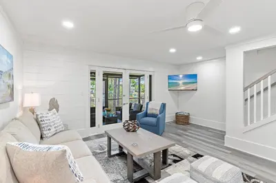 a living room with a couch and a table at Wise Choice on 30A in Santa Rosa Beach