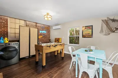 a room with a table and a chess board at Down By The Bay St Andrews Gem in Panama City