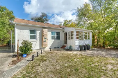 a small white house with a front yard at Down By The Bay St Andrews Gem in Panama City