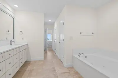 a white bathroom with two sinks and a tub at Legacy 202 in Santa Rosa Beach