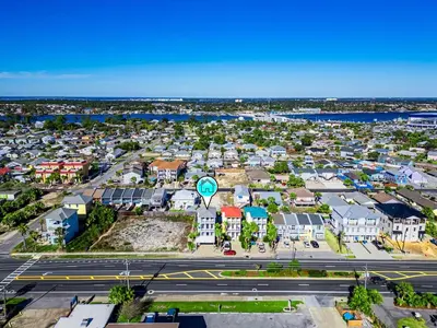 an aerial view of a city with houses and a street at Beach House w/ Private Pool Near PCB | Dog Friendly in Panama City Beach