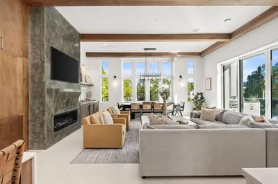 a living room with couches and a fireplace at 30a Gulf-View Gem | Stay Gold in Santa Rosa Beach