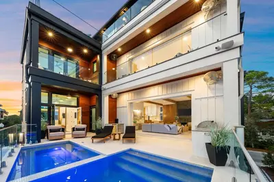 an exterior view of a house with a swimming pool at 30a Gulf-View Gem | Stay Gold in Santa Rosa Beach