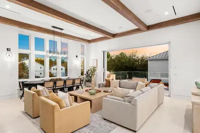 a living room with couches and a table at 30a Gulf-View Gem | Stay Gold in Santa Rosa Beach