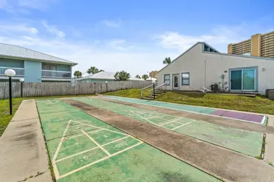 a house with a painting on the yard at Quiet West End PCB Condo w/ Gulf Views, Pool & Easy Beach Access in Panama City Beach