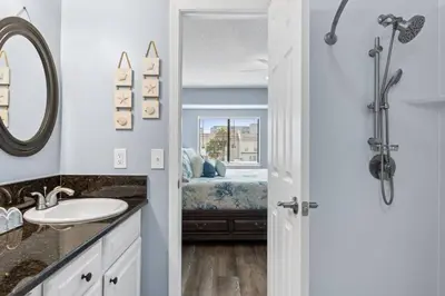 a bathroom with a sink and a mirror at Pet-Friendly Coastal Townhome | Walk to Beach & Local Dining in Panama City Beach