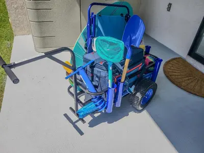 a blue wheelchair parked next to a chair at Renovated Condo 4-Min Walk to Beach & Pools in Panama City Beach