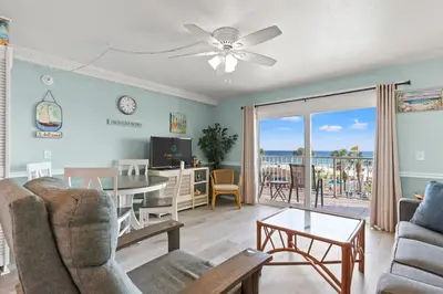 a living room with a view of the ocean at The Summit 315 in Panama City Beach