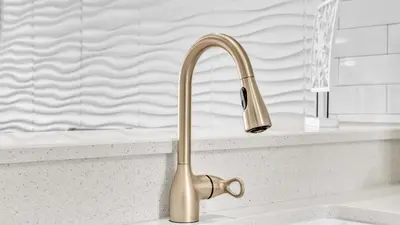 a kitchen sink with a gold faucet at Low Floor - Remodeled - Beachfront - FLPCB65 in Panama City Beach