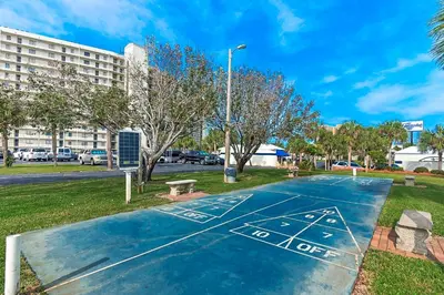a basketball court in a park with a building at Low Floor - Remodeled - Beachfront - FLPCB65 in Panama City Beach