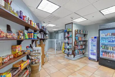 a store aisle with shelves of food and drinks at Grand Panama Beach Resort by Panhandle Getaways in Panama City Beach