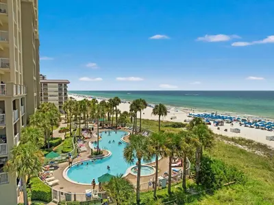 an aerial view of a resort with a swimming pool and the beach at Grand Panama Beach Resort by Panhandle Getaways in Panama City Beach