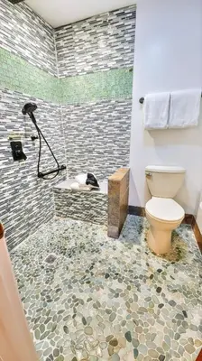 a bathroom with a toilet and a shower at 3BR Grand Lagoon Front Townhome - Private Dock, Resort Amenities & Beach Walk in Panama City Beach
