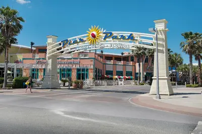 a large building with a large sign on a street at Calypso 1-1805 by Emerald Coast Retreats in Panama City Beach