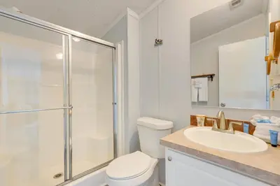 a bathroom with a shower and a toilet and a sink at 2 Blocks to Beach! Family-Friendly Home in PCB in Panama City Beach