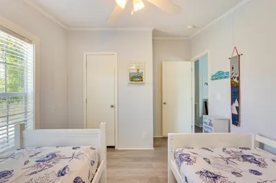 a bedroom with two beds and a window at 2 Blocks to Beach! Family-Friendly Home in PCB in Panama City Beach
