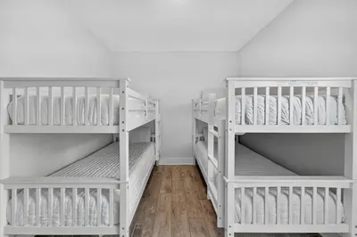 two white bunk beds in a room at New Construction - West End PCB - Gated Neighborhood - FLPCB63 in Panama City Beach